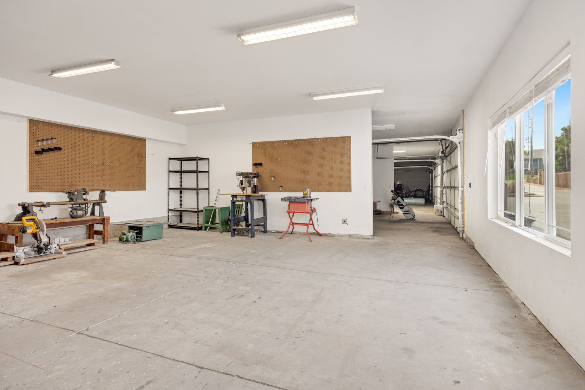 Pegboard tool storage in a dedicated hobby workshop space at home