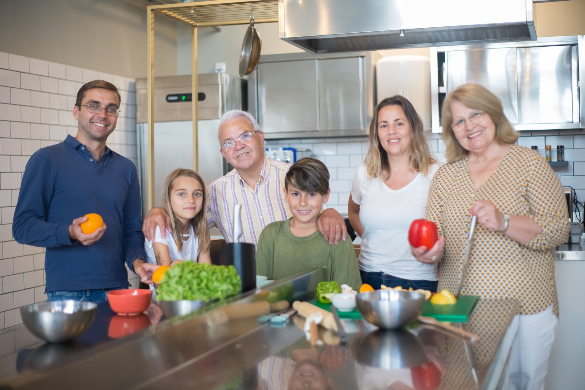 Three generations of a British family at home, illustrating multigenerational living UK wellbeing